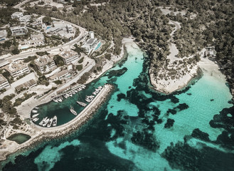 Beautiful birdeye view on the sea coastline with pier and yakhts