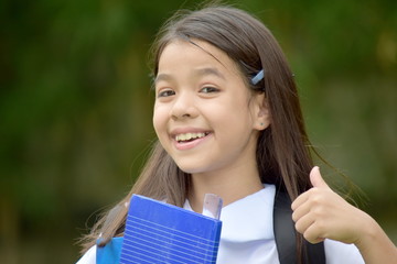 Fototapeta premium Happy Child Girl Student Wearing Uniform With Books