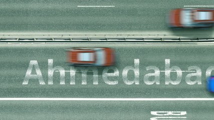 Aerial top-down view of the road. Cars reveal Ahmedabad text. Travel to India conceptual clip