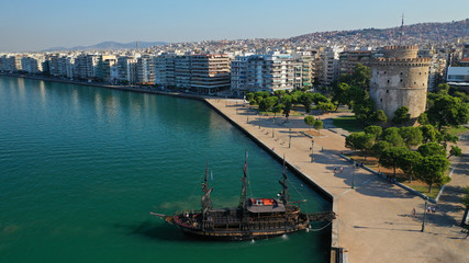 Fototapeta premium Aerial drone view of iconic historic landmark - old byzantine White Tower of Thessaloniki or Salonica, North Greece