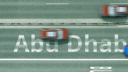 Overhead view of the busy car road with Abu Dhabi text. Travel to United arab emirates intro clip