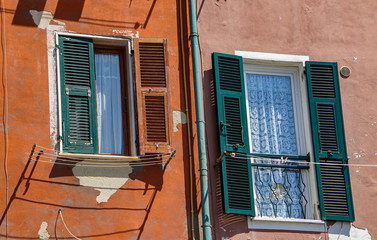 Beuatiful and authentic windows with shutters in Italy 