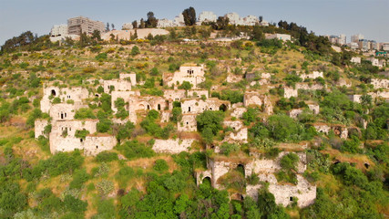 Flying over abandoned Palestinian Lifta Village  Aerial view of Lifta abandoned Palestinian Village with  the main entrance to Jerusalem in the background 