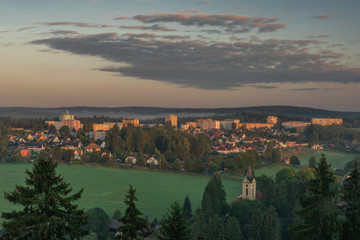 Fototapeta premium Rotava town in sunrise time with block of flats in summer morning
