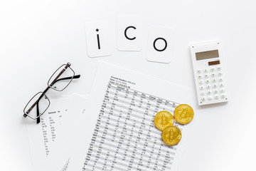 Initial coin offering ICO with coins, calculation table, office tools on white background top view
