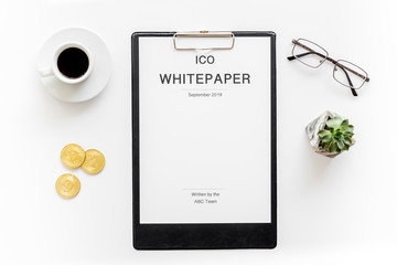 White paper ICO, coins, glasses, coffee on white background top view