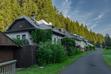 Fototapeta na wymiar Houses in Ruzove valley with road in summer sunny hot day