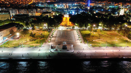 Aerial drone night shot of famous promenade area in new waterfront of Thessaloniki or Salonica...