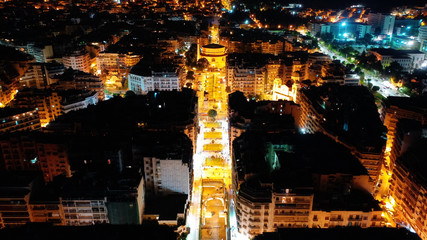 Aerial drone night shot of iconic illuminated Rotunda cylindrical monument in the heart of Thessalloniki or Salonica, North Greece