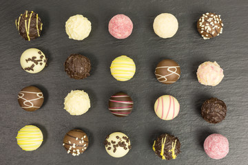 background of different chocolate truffles