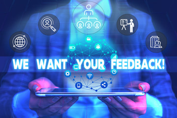 Fototapeta premium Word writing text We Want Your Feedback. Business photo showcasing criticism given someone say can be done for improvement Male human wear formal work suit presenting presentation using smart device
