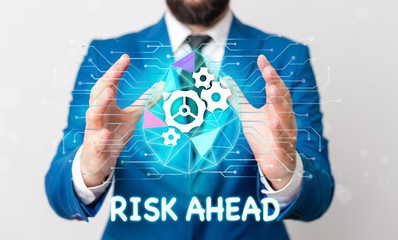 Text sign showing Risk Ahead. Business photo text A probability or threat of damage, injury, liability, loss Male human wear formal work suit presenting presentation using smart device
