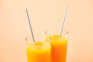 Two Orange Juice Glass with Metallic Steel Tubes