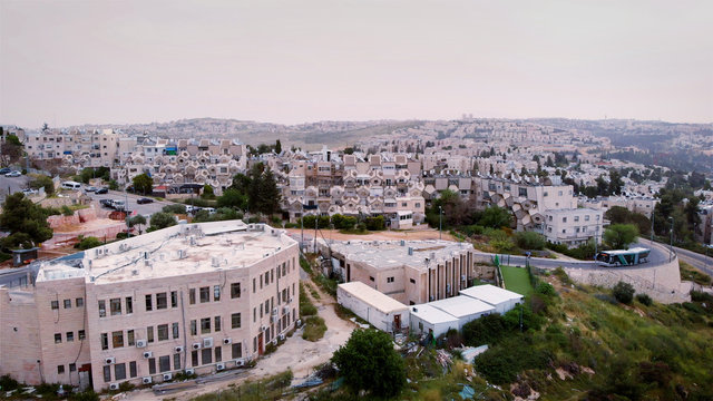 Flying over orthodox jewish neighborhood in Jerusalem  Aerial view over Ramot orthodox jewish neighborhood in Jerusalem