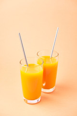 Two Orange Juice Glass with Metallic Steel Tubes