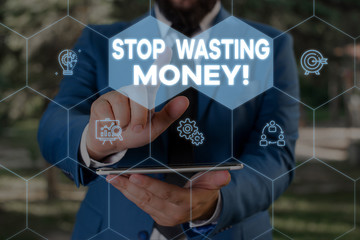 Handwriting text writing Stop Wasting Money. Conceptual photo advicing demonstrating or group to start saving and use it wisely Male human wear formal work suit presenting presentation using smart