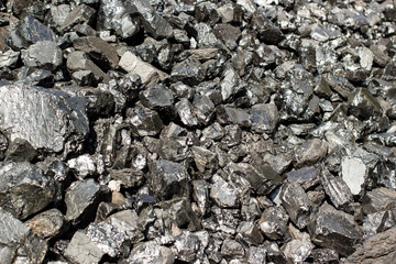 Pile of natural black hard coal for texture background. Grade anthracite coals often referred to as stone coal and black diamond coal.
