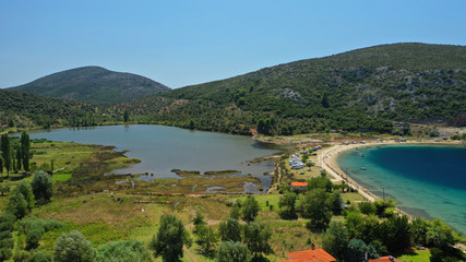 Fototapeta premium Aerial drone photo of iconic paradise bay and sandy beach of Porto Koufo with turquoise calm sea protected by winds, South Sithonia Peninsula, North Greece