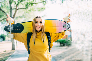 Portrait of pretty blonde girl with skateboard © clementetinin