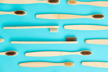 Wooden Toothbrush Isolated on Blue Background Copy Space