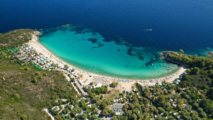 Fototapeta na wymiar Aerial drone photo of famous turquoise sandy beach of Armenistis in South Sithonia peninsula, Halkidiki, North Greece