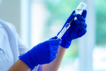 Vaccination during an epidemic and viral infectious diseases. Injection of an antibiotic to a patient in a hospital