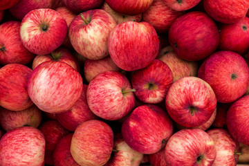 Homemade delicious red apples closeup, background.