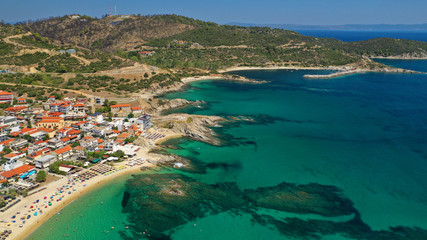 Obraz premium Aerial drone photo of famous village and long sandy beach of Sarti in South Sithonia, Halkidiki, Greece