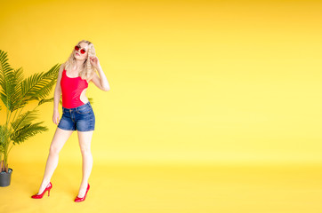 Fashionable woman wear red shirt and jeans shorts