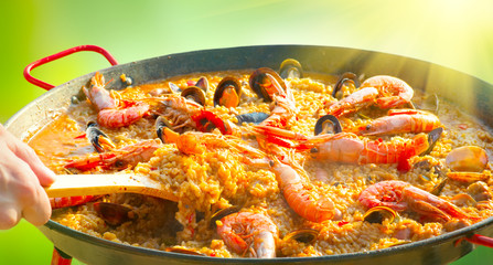 Paella. Traditional spanish food, seafood paella in the fry pan with mussels, king prawns, langoustine and squids