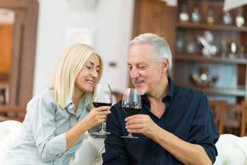 Couple drinking a glass of red wine