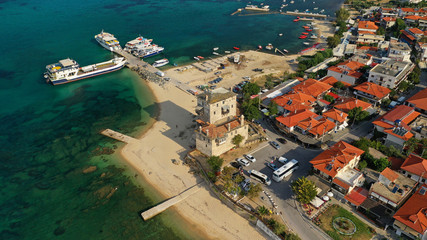 Fototapeta na wymiar Aerial drone view of iconic medieval seaside town of Ouranoupolis featuring famous tower, Halkidiki, North Greece