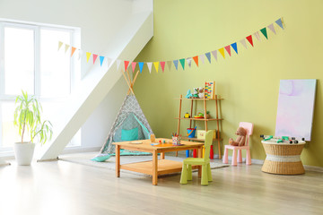 Interior of modern children's room with toys