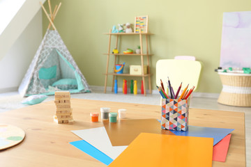 Obraz premium Table with stationery in children's room