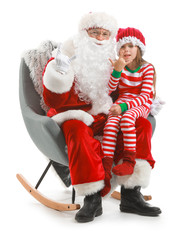 Santa Claus and little girl showing 