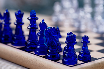 blue chess. Knight on the chessboard. Closely