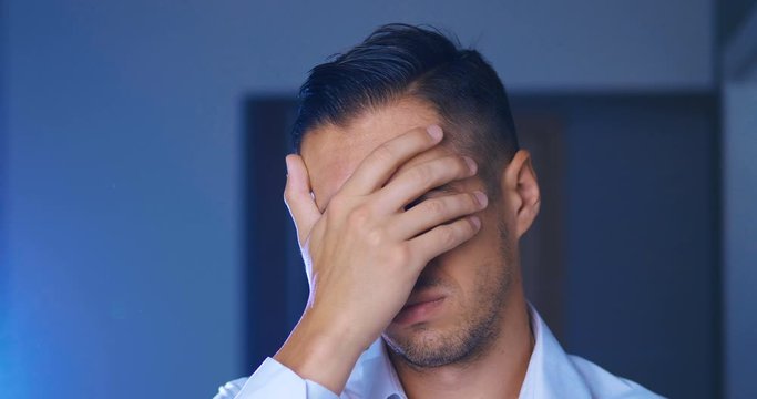Man is ashamed and rejected for what he saw. Businessman covering face like Facepalm expressing Frustration or Shame.