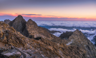 Obraz na płótnie Canvas Mountains Landscape with Inversion in the Valley at Sunset as seen From Rysy Peak in High Tatras, Slovakia
