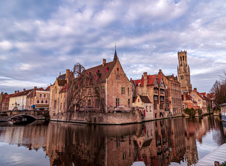 Typical beautiful view from Quay of the Rosary (Rozenhoedkaai) in Bruges with reflections in the water. Bruges, Belgium