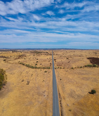 Aerial view of a country road in spring. Alentejo, Portugal. Drone view