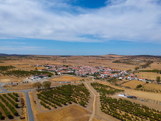 Aerial view of a agricultural field with a small village in Portugal