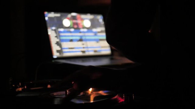 Music Making Electronic DJ Scratching Records Dimly Lit Night Clubbing