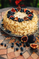puff cake, sponge cake with figs and blueberries, sectional view, mouth-watering dessert