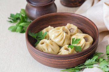 Homemade Pozi o manti o Buzi o Buuza - is a type of dumpling traditional for Caucasus, Central Asia. Consist off a spiced ground beef in a dough wrapped. Steamed.