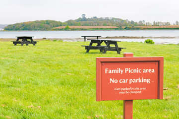 Sign at a family Picnic area warning that cars will be clamped if parked in this area, Strangford...