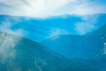 Layers of mountains in the haze and fog.