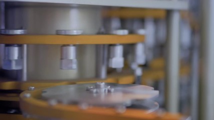 Pharma industry, medicine and automated technology equipment concept. Automatic inspection machine equipment for quality control of medical ampoules and vials at pharmacy factory or medical exhibition