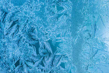 New Year and Christmas abstract icy frost cold weather snowy blue background with real ice crystals macro