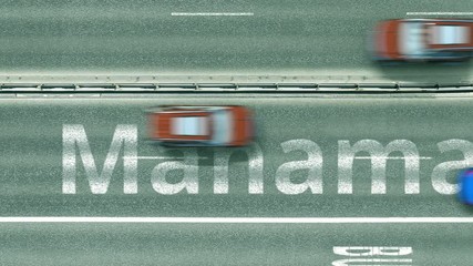 Overhead view of the busy car road with Manama text. Travel to Bahrain intro clip