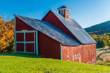 Red barn during a New England fall foliage.